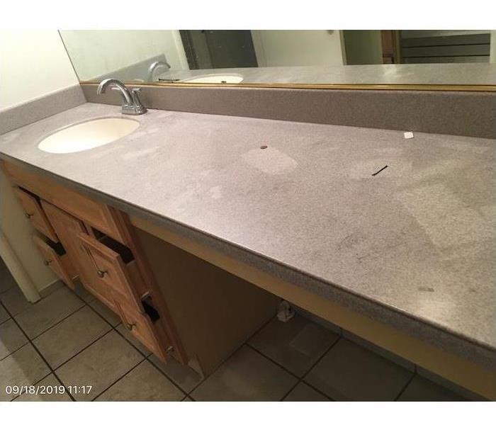 Bathroom with smoke damage on the countertops